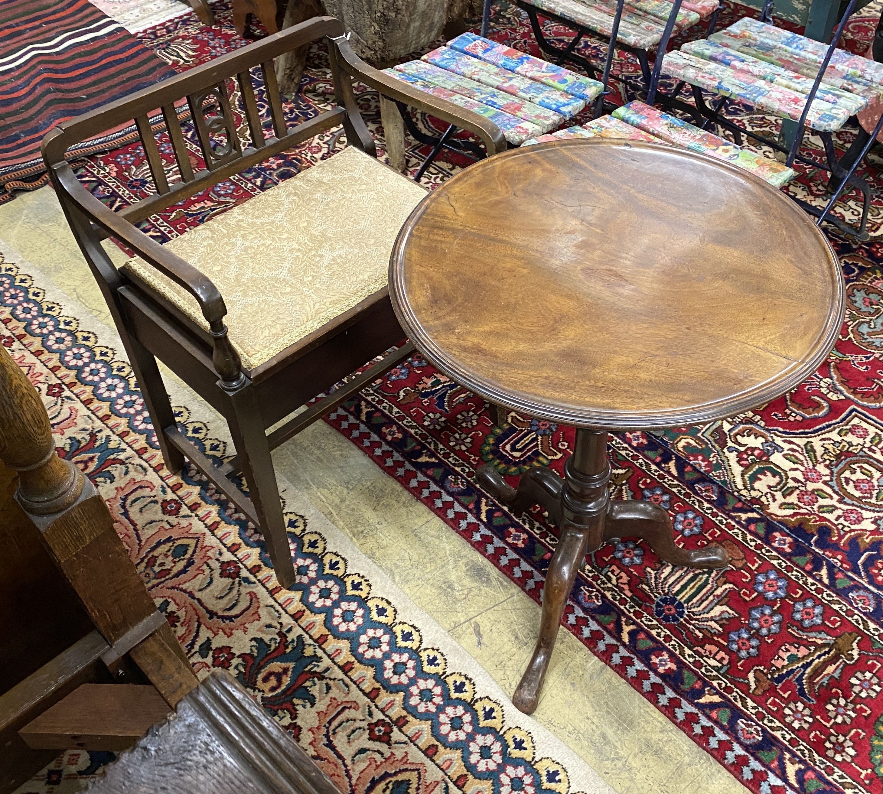 A Georgian mahogany circular tilt top tripod table with dished top, diameter 54cm, height 70cm together with an Edwardian piano stool